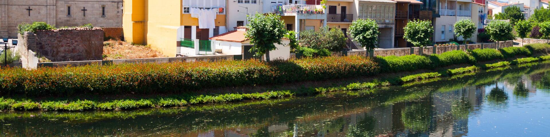 river and old houses at Monforte de Lemos in summer day. Galicia