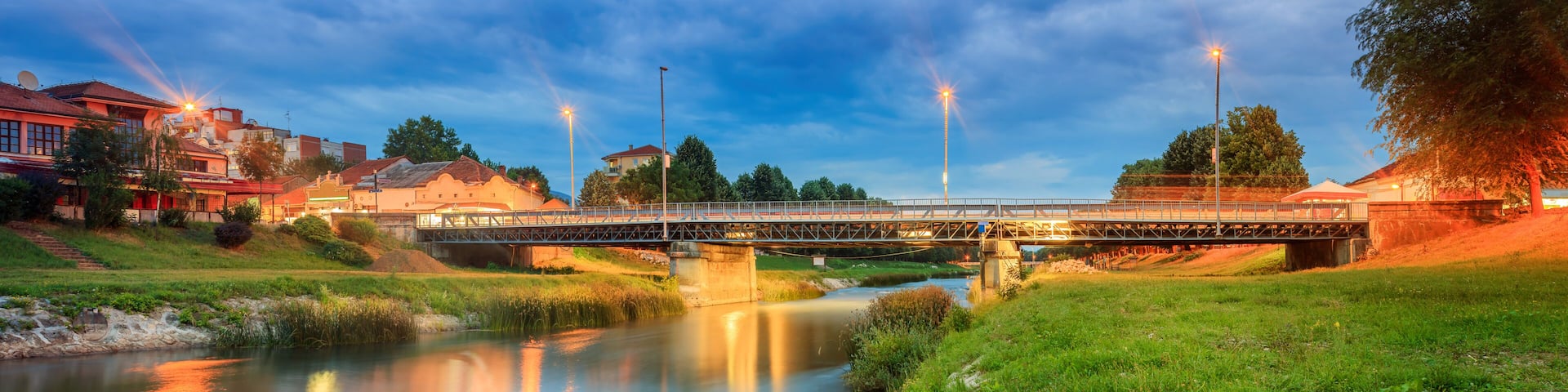 Panoramic view of central bridge in Pirot, Serbia, called Golemi most over river Nisava during late blue hour