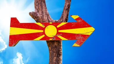 Macedonia Flag wooden sign with sky background