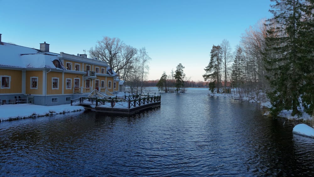 A old building at a lake during winter