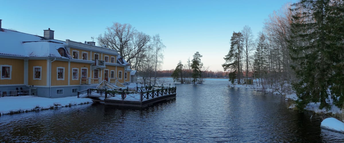 A old building at a lake during winter
