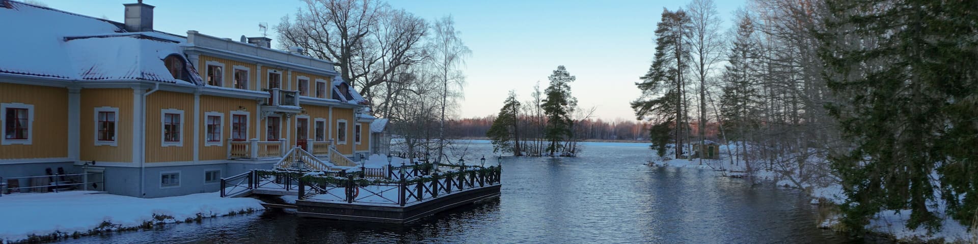A old building at a lake during winter