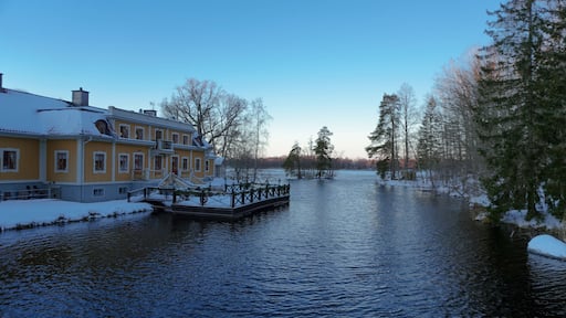 A old building at a lake during winter