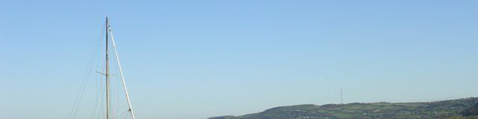 High and dry! Looking to the northeast across the mud and sand of Red Wharf Bay at low tide. The TV transmitter mast at Llandona is prominent on the skyline beyond.