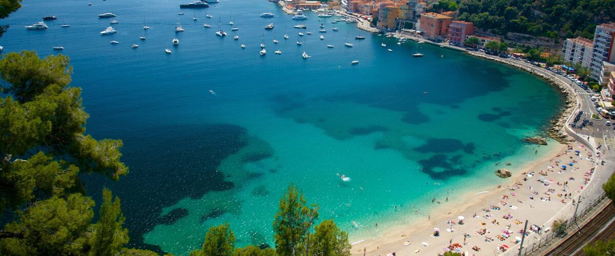 French Riviera which includes general coastal views, a coastal town and a bay or harbor