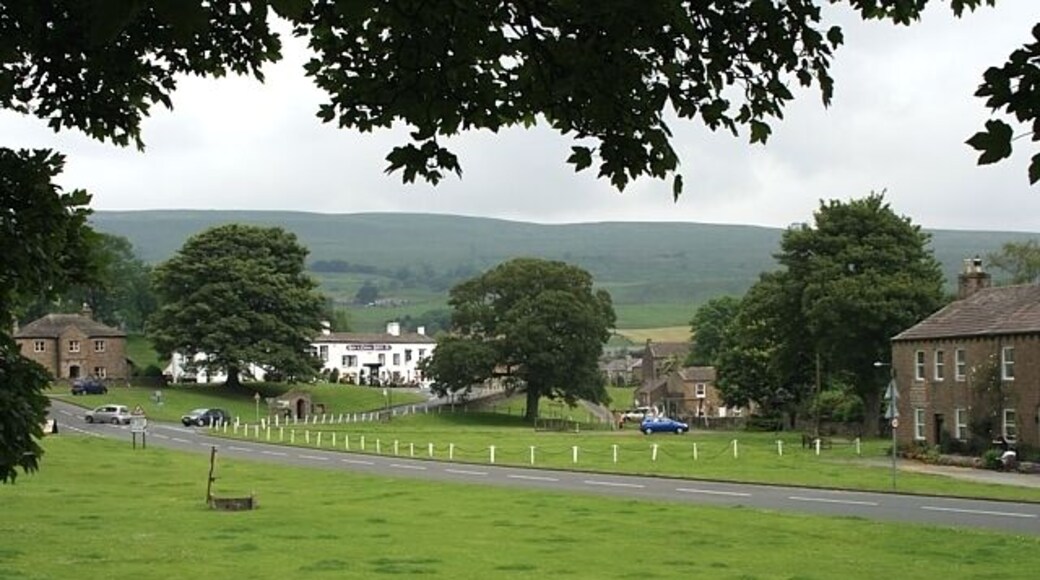 Bainbridge green Village stocks in the left foreground. The white building is the Rose & Crown Hotel.