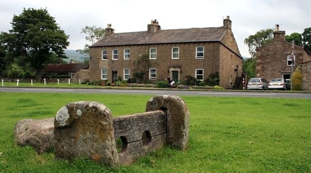 The old stocks, Bainbridge Most likely dating from the 17th century, the stone alongside is thought to have been a seat - look out for low-flying rotten vegetables!