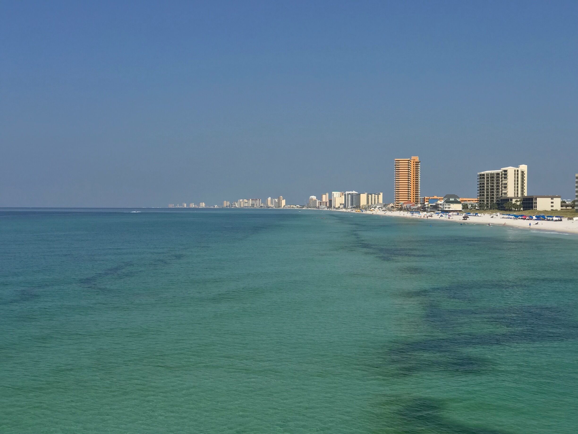 View of Panama City Beach from St. Andrews pier.  Water is a beautiful emerald green at St. Andrews.  Great place to ride bikes with multiple public beach access points. 