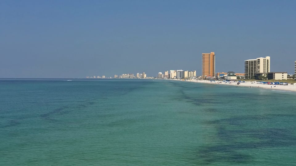 View of Panama City Beach from St. Andrews pier. Water is a beautiful emerald green at St. Andrews. Great place to ride bikes with multiple public beach access points.