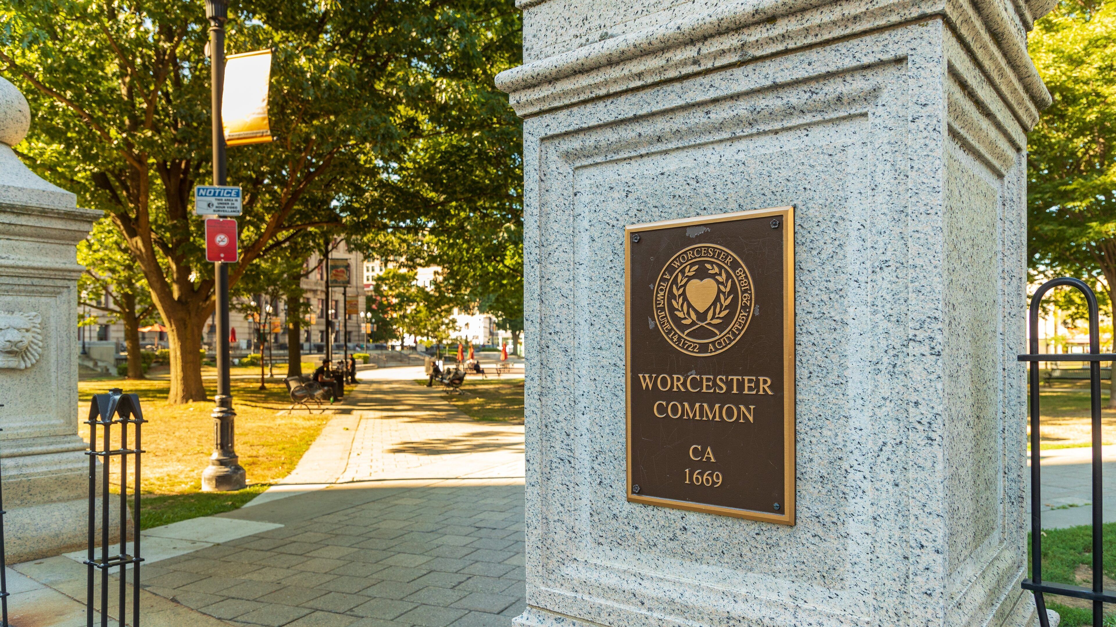 A granite monument with a plaque reading "Worcester Common CA 1669".