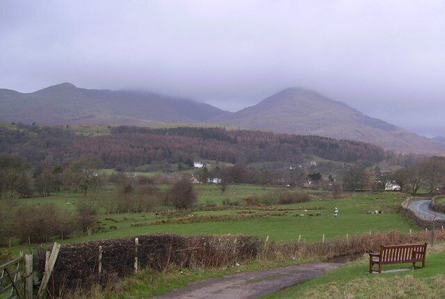 Viewpoint near Torver The wooden seat is placed so passers by can admire Coniston Old man and Dow Crag seen mist topped above Torver.