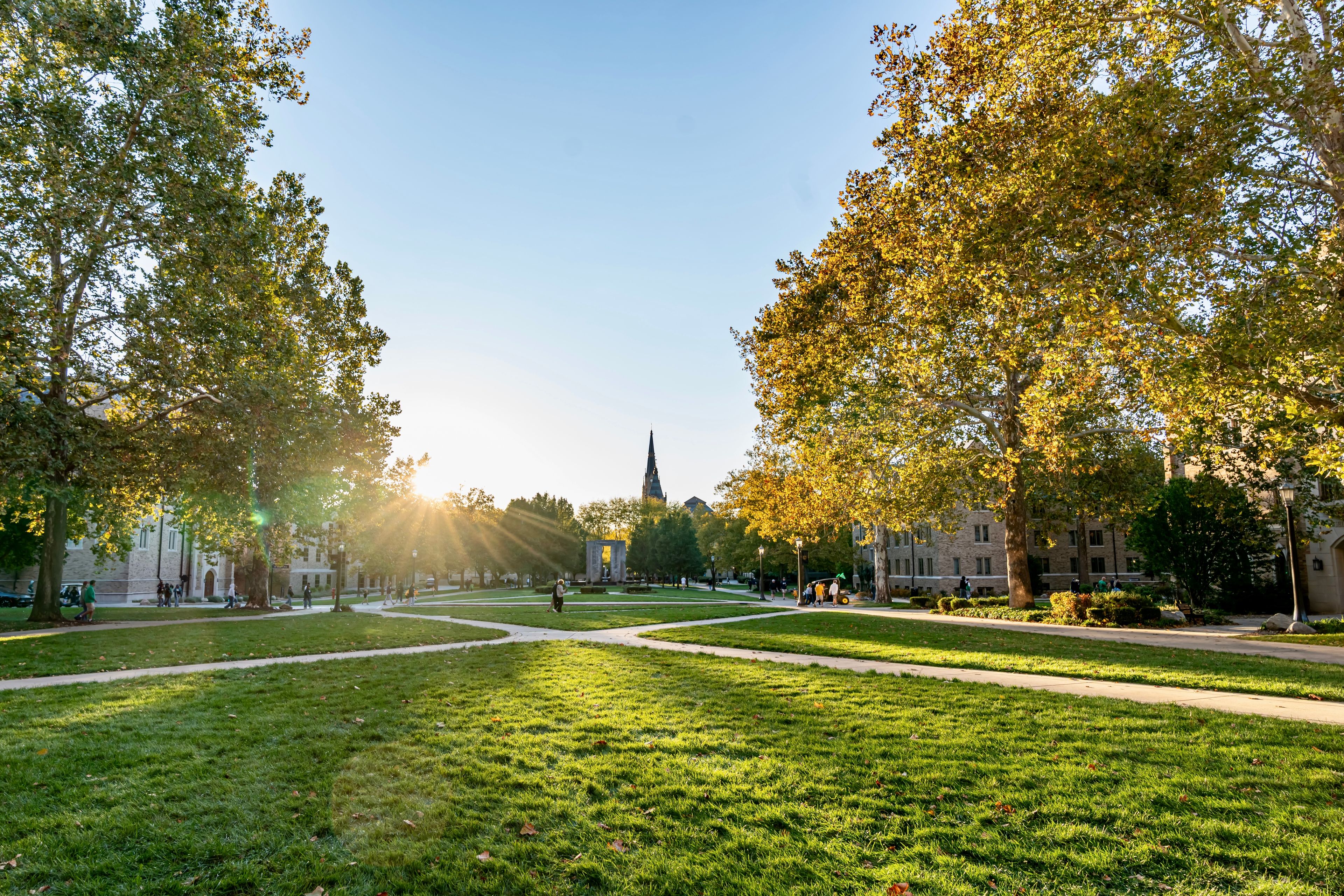 The sun setting on the campus of the University of Notre Dame on a bright sunny day