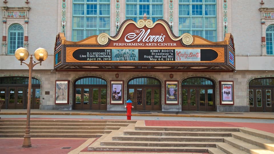 A theater marquee with the name "Morris Performing Arts Center" and a red fire hydrant in front.