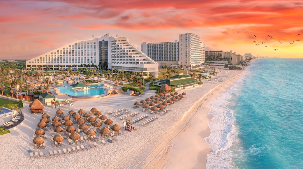 Cancun beach with resorts near blue ocean