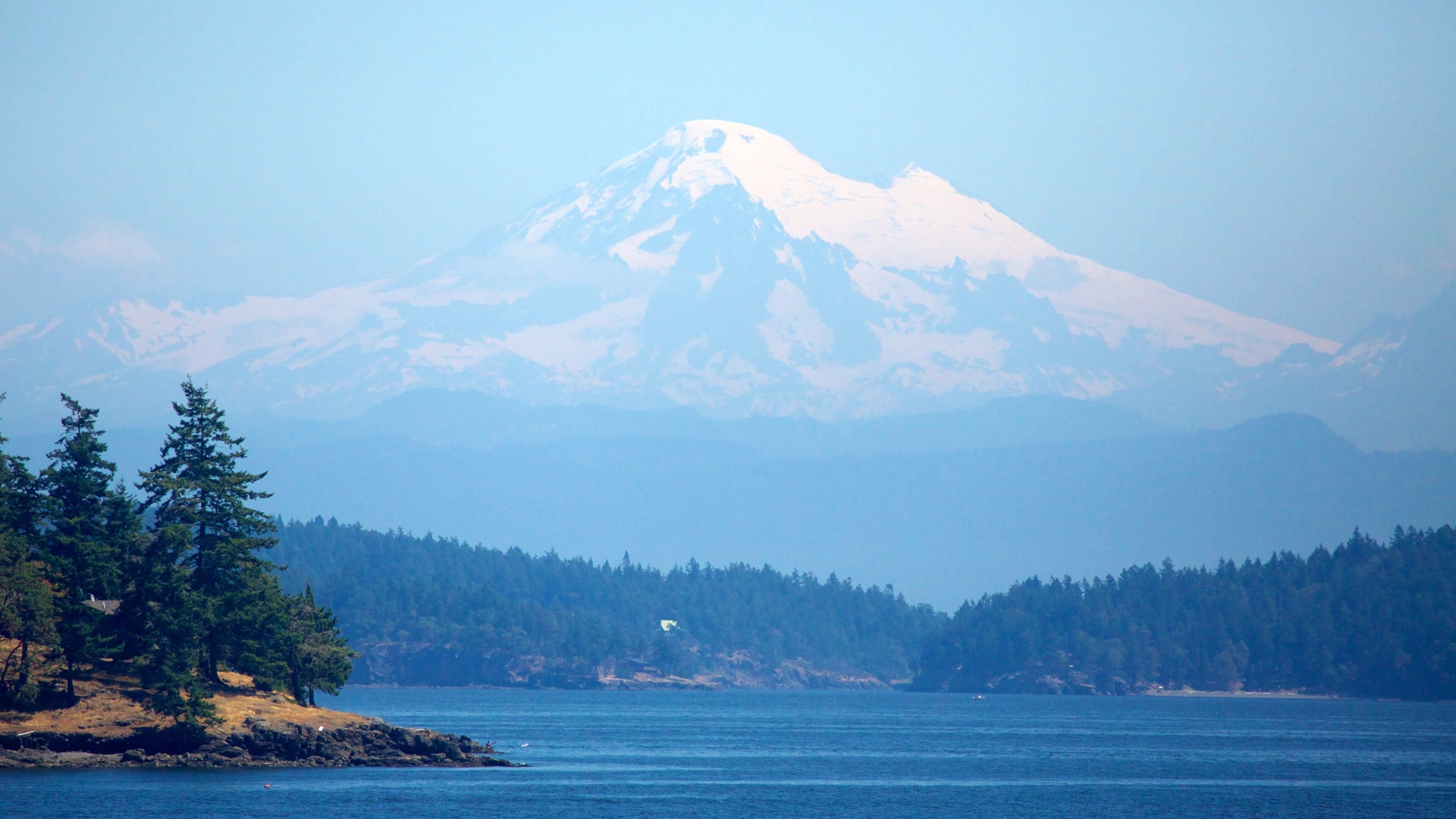San Juan Islands showing landscape views, snow and a lake or waterhole