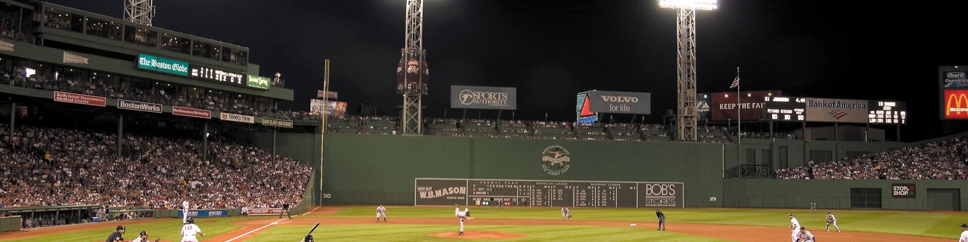 Nighttime baseball game at Fenway Park showcasing a vibrant atmosphere in Boston, Massachusetts
