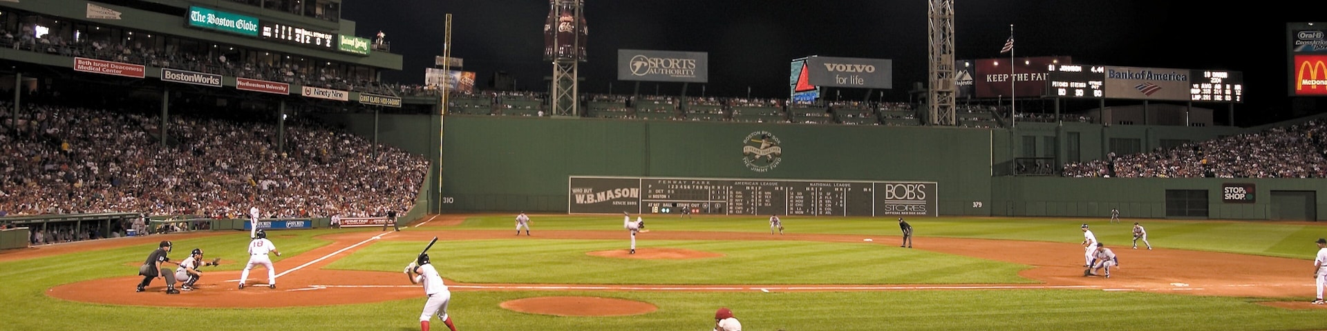 Nighttime baseball game at Fenway Park showcasing a vibrant atmosphere in Boston, Massachusetts