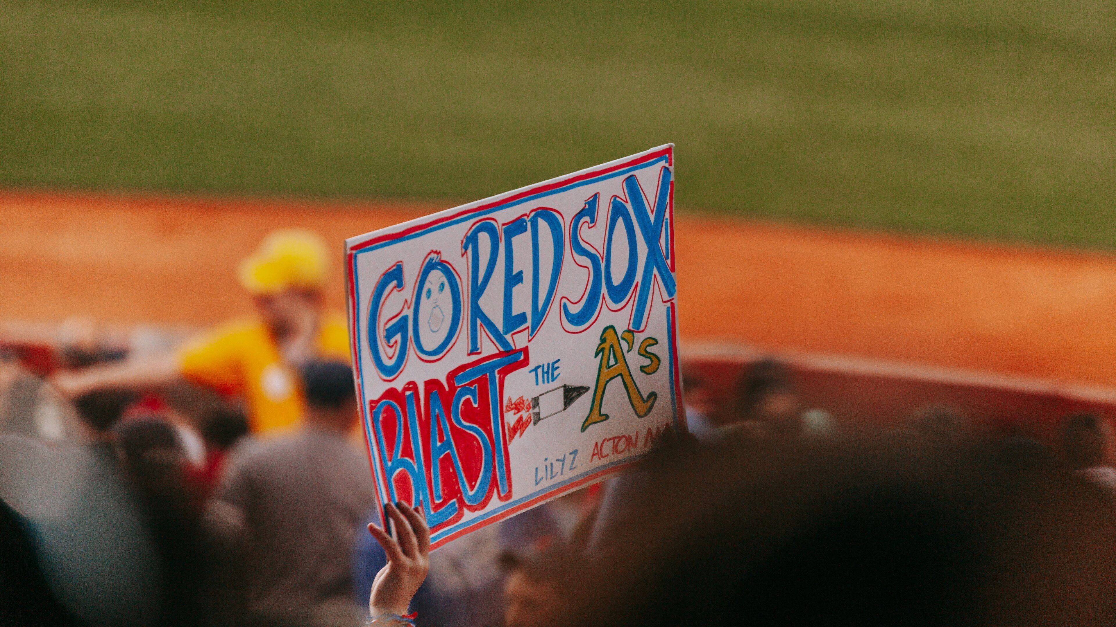 Fenway Park which includes signage and a sporting event