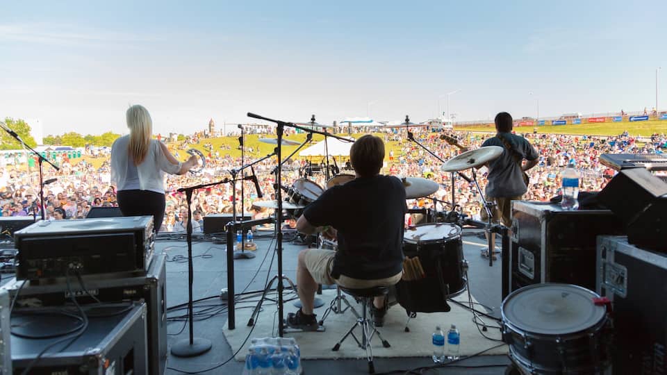 Saginaw featuring performance art and music as well as a large group of people