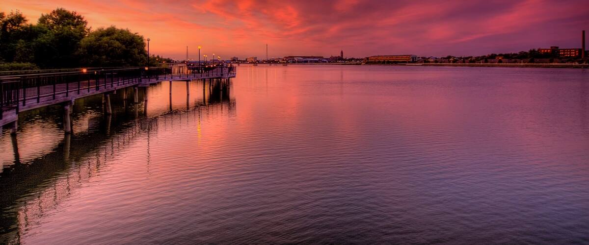 Saginaw which includes a river or creek and a sunset