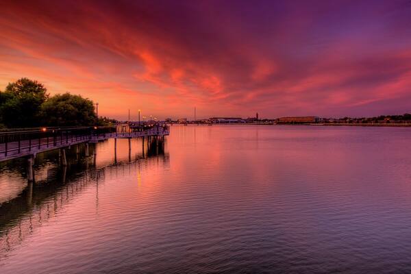 Saginaw which includes a river or creek and a sunset