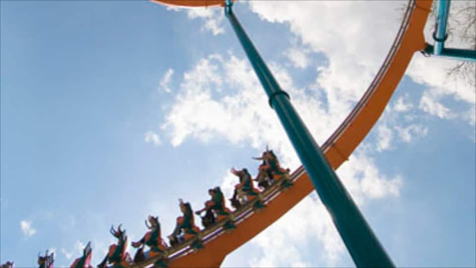 A roller coaster track against a clear sky.