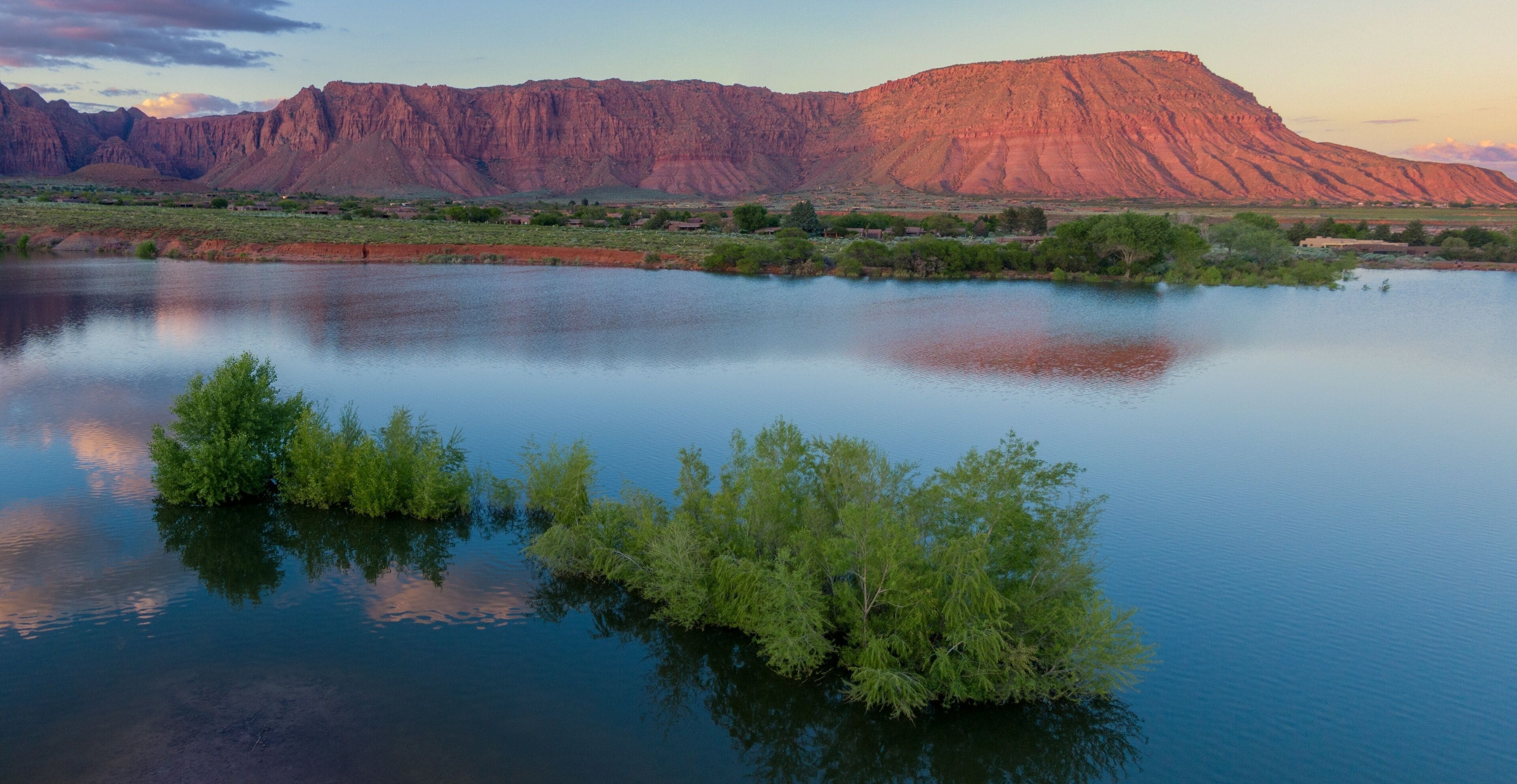 Ivins Reservoir and mountain range at sunset, Ivins, Utah, United States of America.