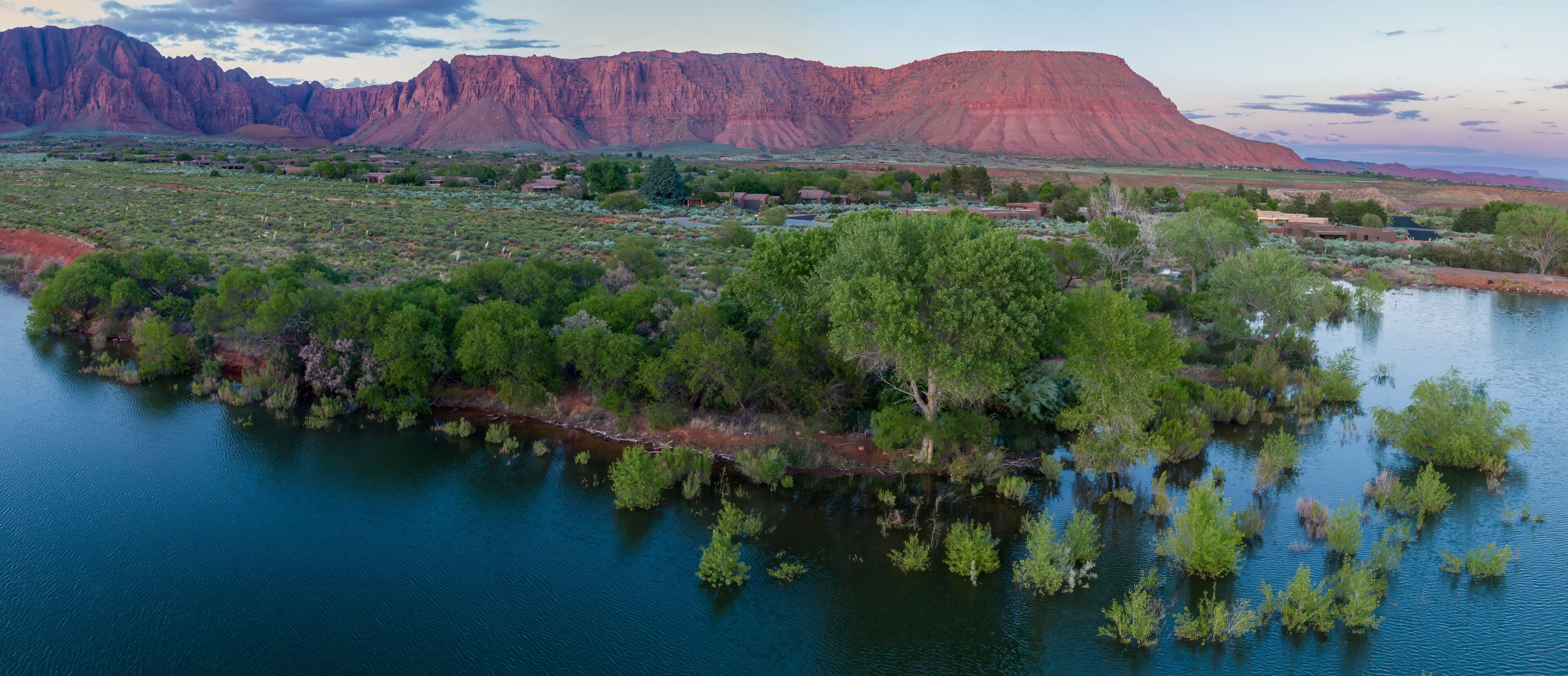 Ivins Reservoir and mountain range at sunset, Ivins, Utah, United States of America.