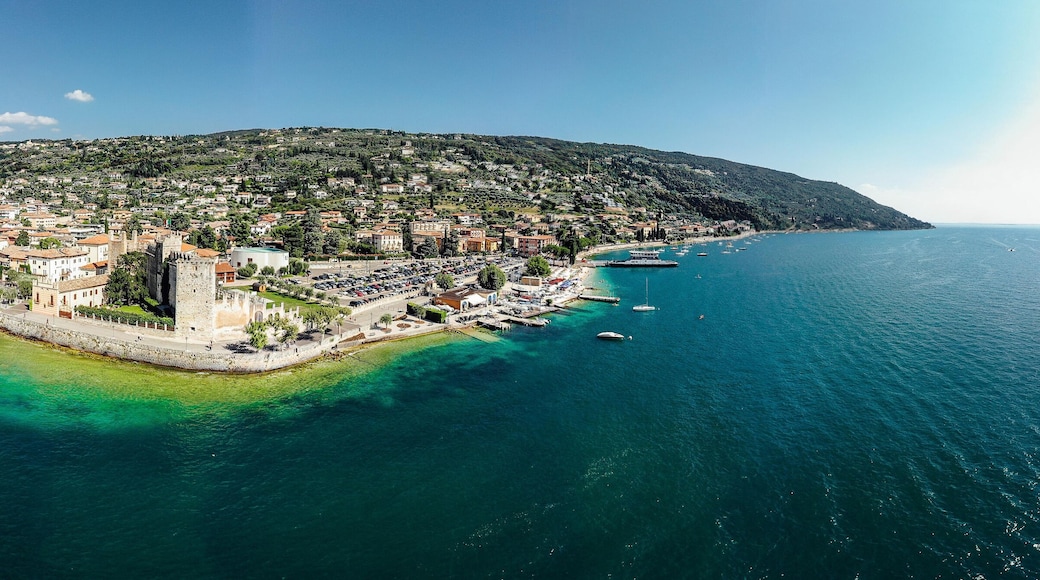 Drone shot of Lago di Garda lake in Italy with a view of the Torri del Benaco comune