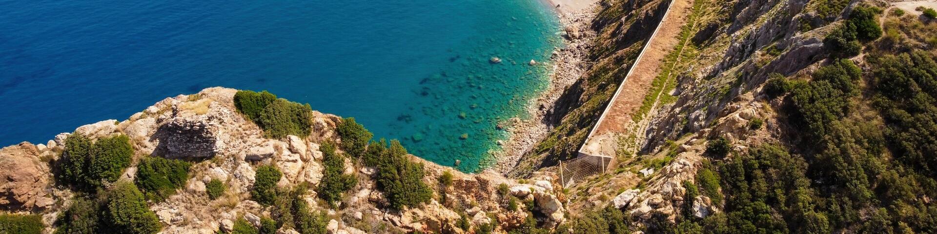 Aerial drone. Capo Calava bay and beach, with several holiday parks, resort and villages, near Gioiosa Marea, Sicily, Italy.