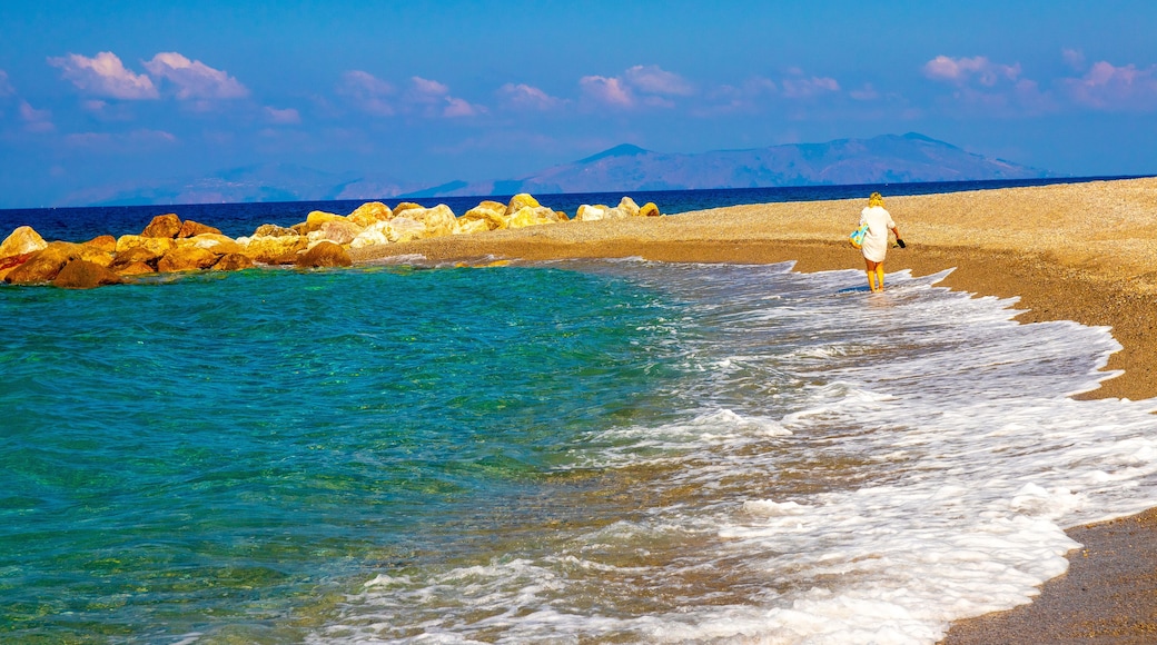 Gioiosa Marea, Sicily, Italy – 01 Oct 2023. Woman walking on the rocky Tyrrhenian coast in the bay of Gioiosa Marea (province of Messina) in Sicily, Italy.