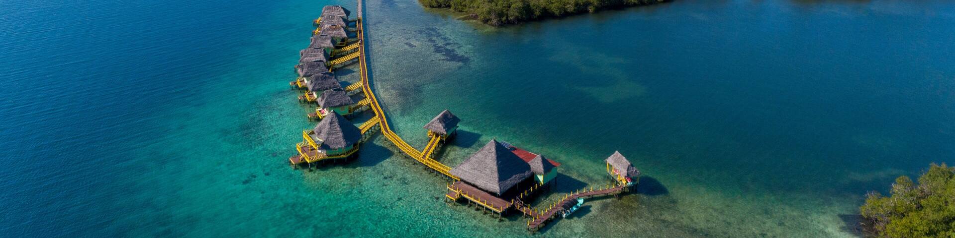 Aerial shot of luxury hotel and water bungalow in the Caribbean sea, Bocas del Toro island, Panama - stock photo