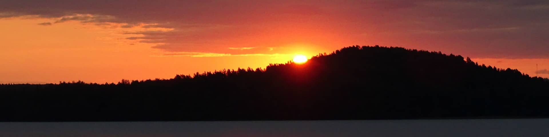 sunrise in red at the lake in Kitee