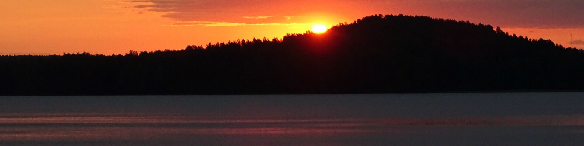 sunrise in red at the lake in Kitee