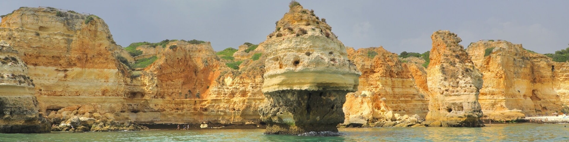 Erosion of the limestone cliffs by the waves creates intriguing shapes in the rocks ...work a boat trip