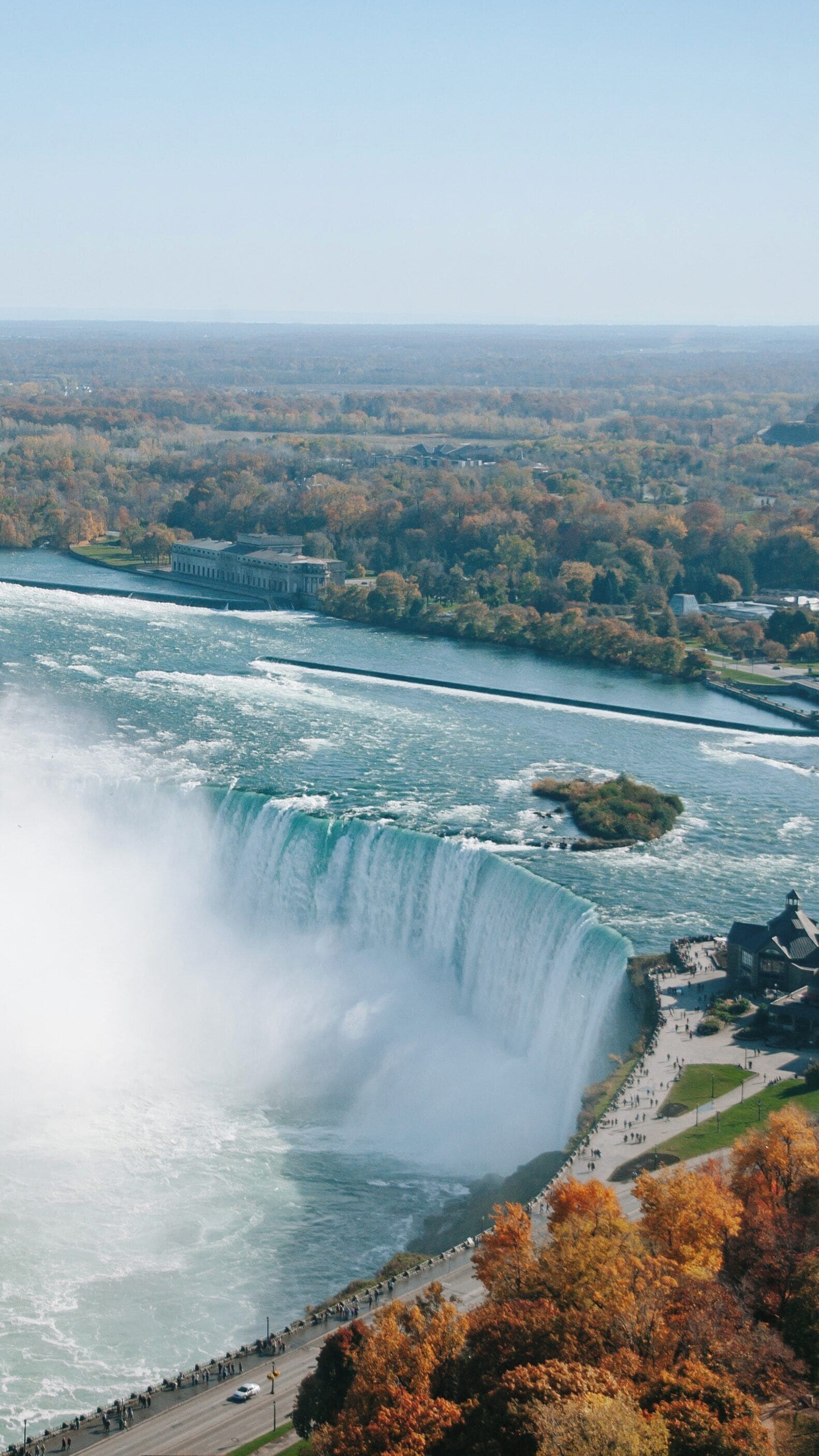 Breathtaking view of Horseshoe Falls cascading in Niagara Falls, Ontario, during autumn, showcasing nature's power and beauty