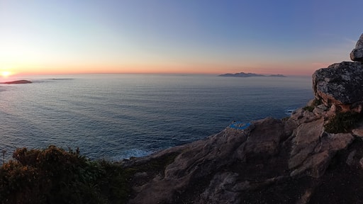 Panoramic view from the compass rose viewpoint in Monteferro of the Cies Islands, the Estelas Islands and Baiona at sunset. Nigran - Spain