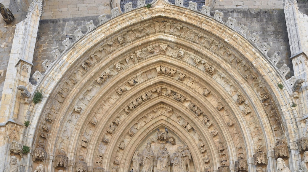 people front of cathedral of Santa Maria de Castello de Empuries, Girona province, Catalonia,Spain