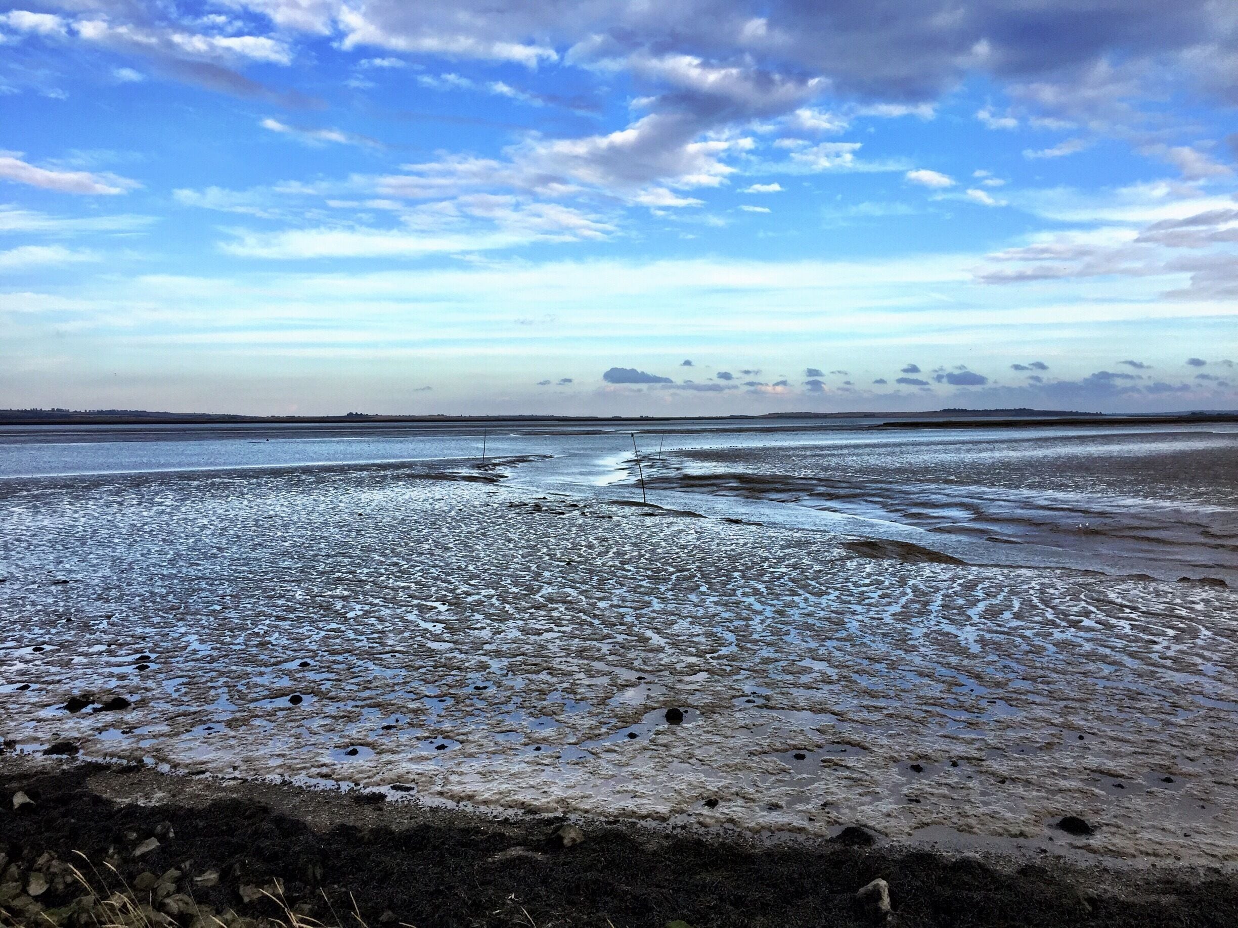 View North East from the Coastal Path leading from Conyer Quay out across the Thames Estuary. A peaceful place. Stop at the Ship Inn in Conyer after your walk.