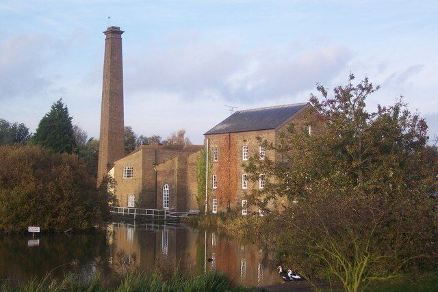 Tonge Mill and reflection in Tonge Mill Pond Seen from Tonge Mill Countryside Park opposite the mill. The ducks in the foreground are Muscovy Ducks. Recent visitors to the pond.