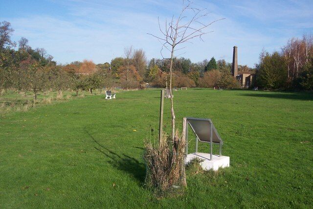 The Royal Air Force Oak Tree, Memorial Way, Tong Mill Park The plaque with this tree reads "This tree is Dedicated to the Memory of the Men and Women of The Royal Air Force. Who made the Supreme Sacrifice in the Service of their Country. Since its formation in 1918. The Royal Air Force. The Women's Royal Air Force and The Women's Auxiliary Air Force. 'Time after time, we saw the cost. To all who fought so well, yet lost. For then a fiery plunge through space, In another Time, another Place'. This Plaque was Unveiled by Squadron Leader A.J.Garlant. RAF (retired) 'We Will Remember Them' The Sittingbourne and Milton Regis Branch. The Royal British Legion". The below that is a line drawing of a Handley Page Halifax Bomber. At the top of the plaque is two line drawings of a Spitfire and Hurricane fighters beside the Royal Air Force Crest.