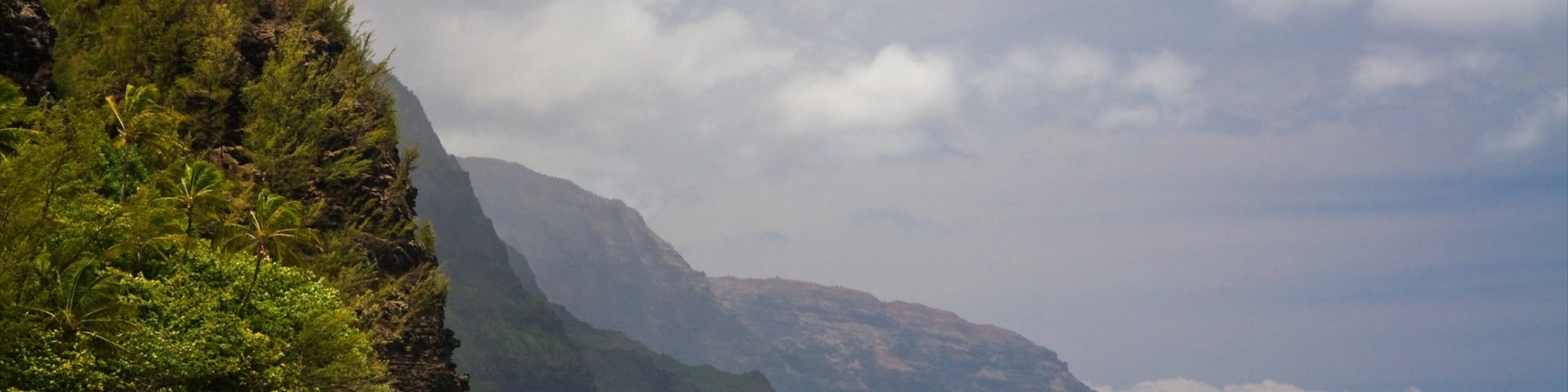 Haena showing mist or fog, a sandy beach and rocky coastline