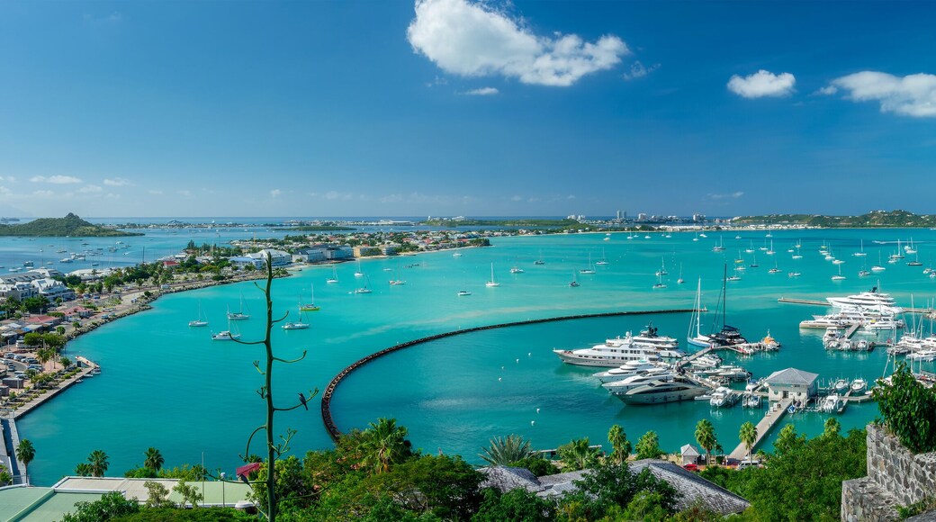 Panoramic view of the bay of Marigot with luxury yachts and boats in the harbor, Caribbean island of Saint Martin (Sint Maarten), French West Indies header