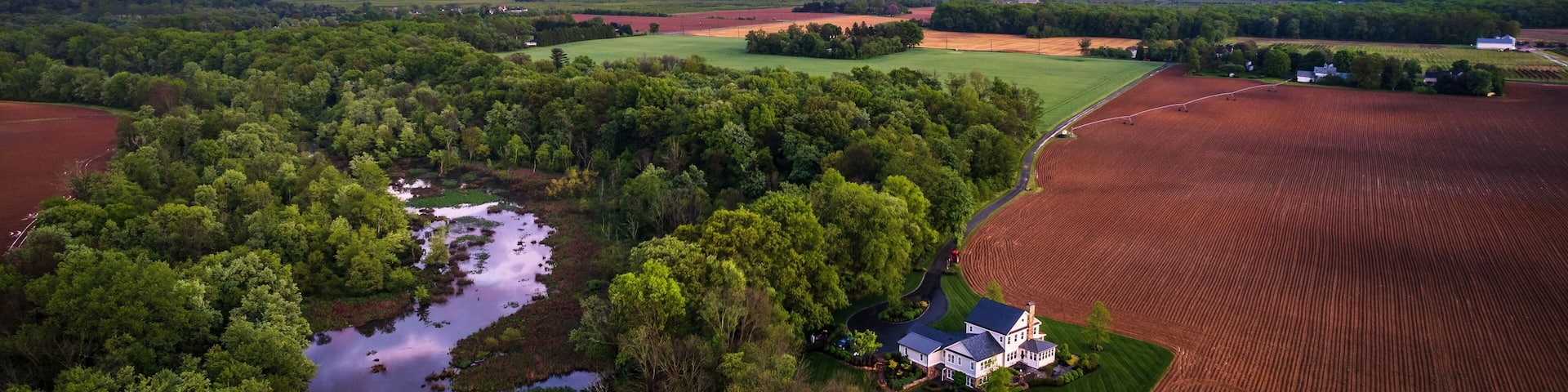 Aerial view of rainbow sunset in the countryside of Cranbury in New Jersey, USA