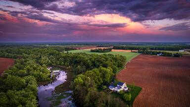 Aerial view of rainbow sunset in the countryside of Cranbury in New Jersey, USA