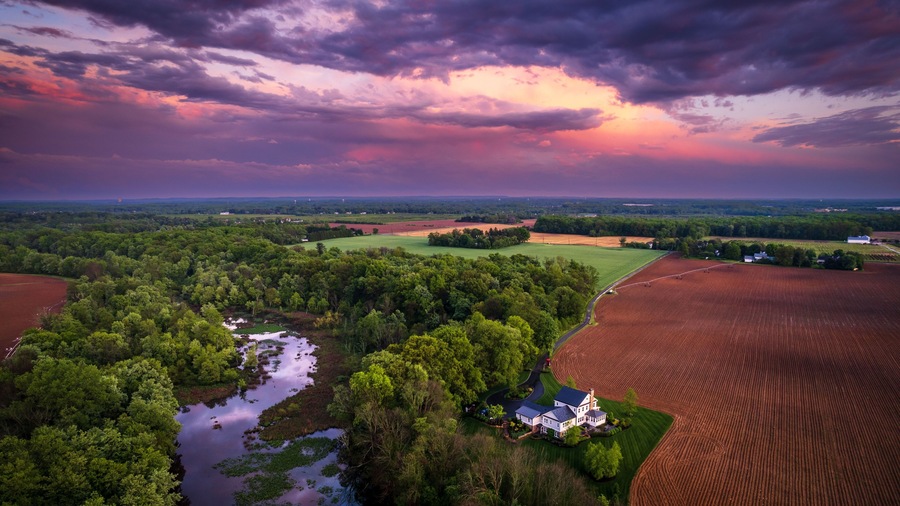 Aerial view of rainbow sunset in the countryside of Cranbury in New Jersey, USA