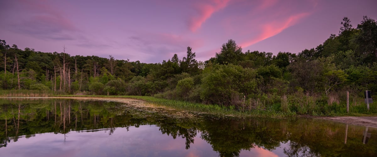 Dusk settles over East Graham Lake, Bald Mountain State Recreation Area, Orion Township, Michigan.