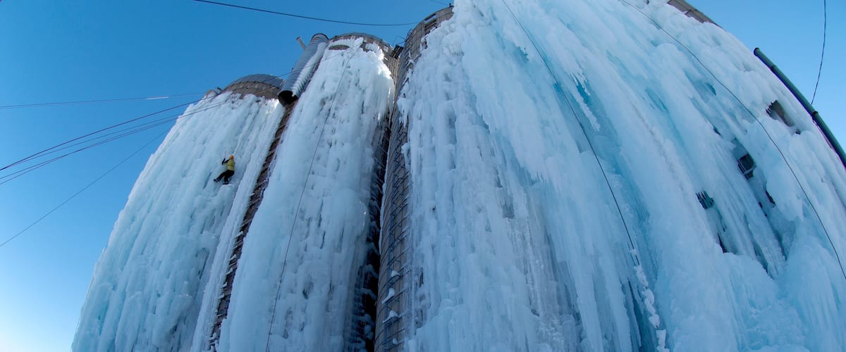 A large ice waterfall cascading down a metal structure.