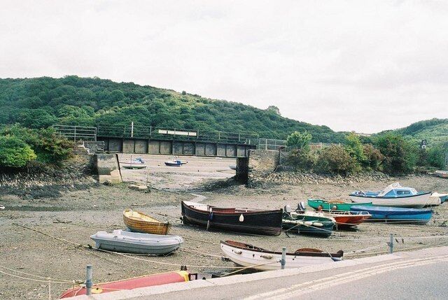 Golant quay: the railway gets in the way. This view from the quayside road at Golant shows how the little quay is separated from the river by the branch line to Fowey (not now a passenger carrying route). The main navigable quay at Golant is a little farther downriver, where the road crosses the railway line to allow access - from where this picture was taken: 495276.