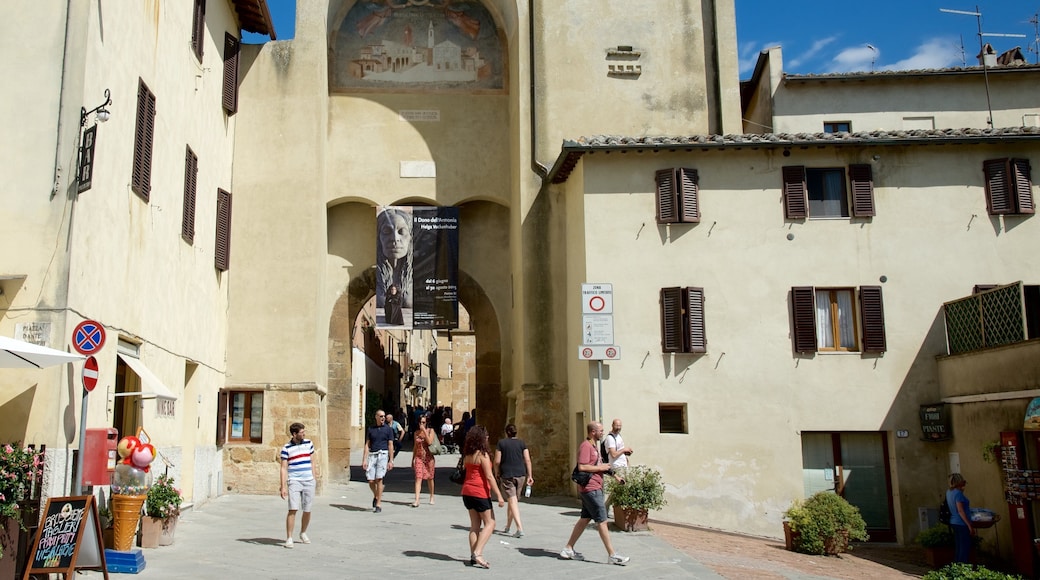 Pienza featuring heritage architecture and a small town or village as well as a small group of people